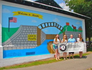 Americorps members in front of the new mural. 